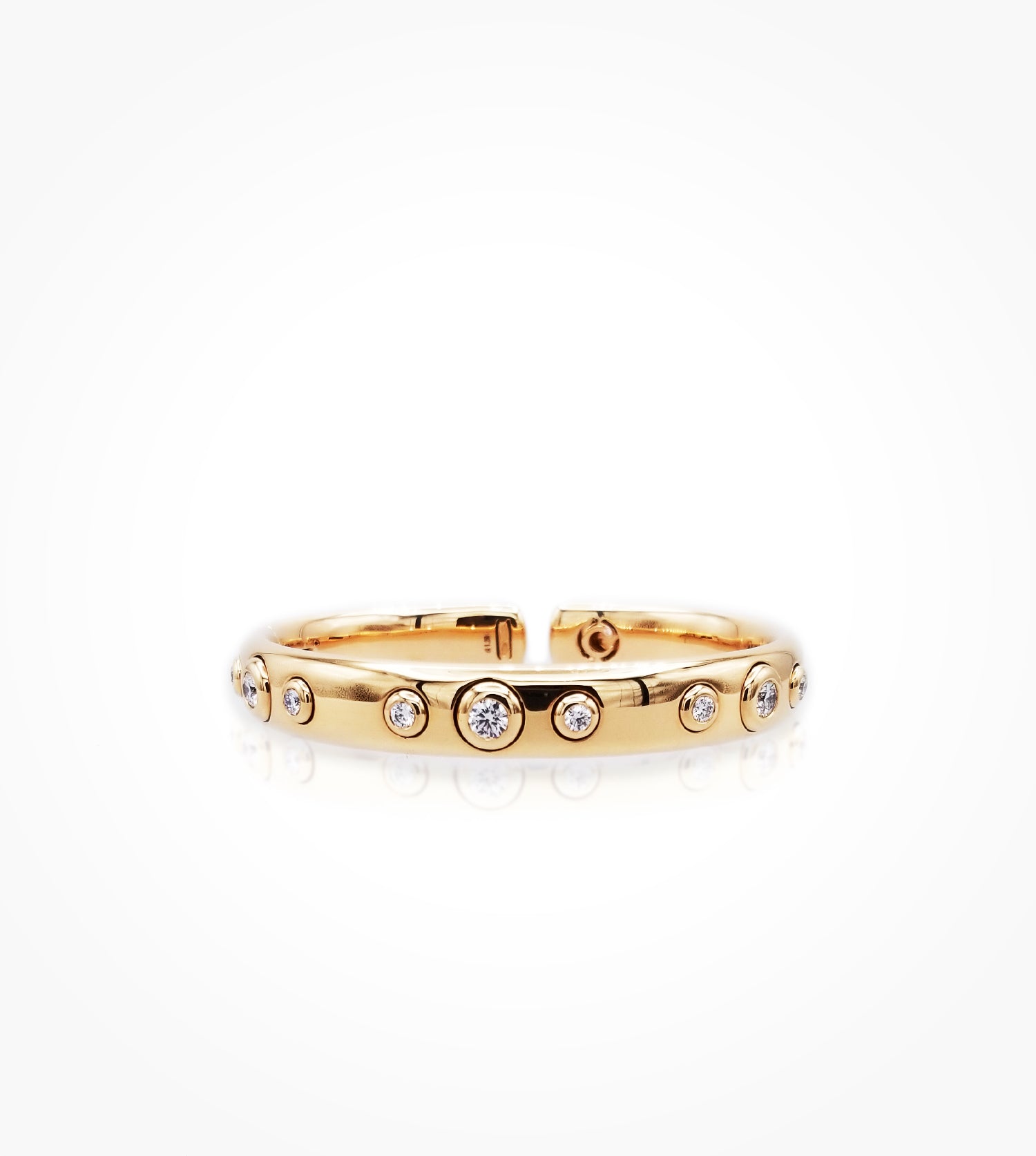 BR07330 18KP hinged bangle with 9bezel set diamonds=1.28cts g si. Call for Pricing