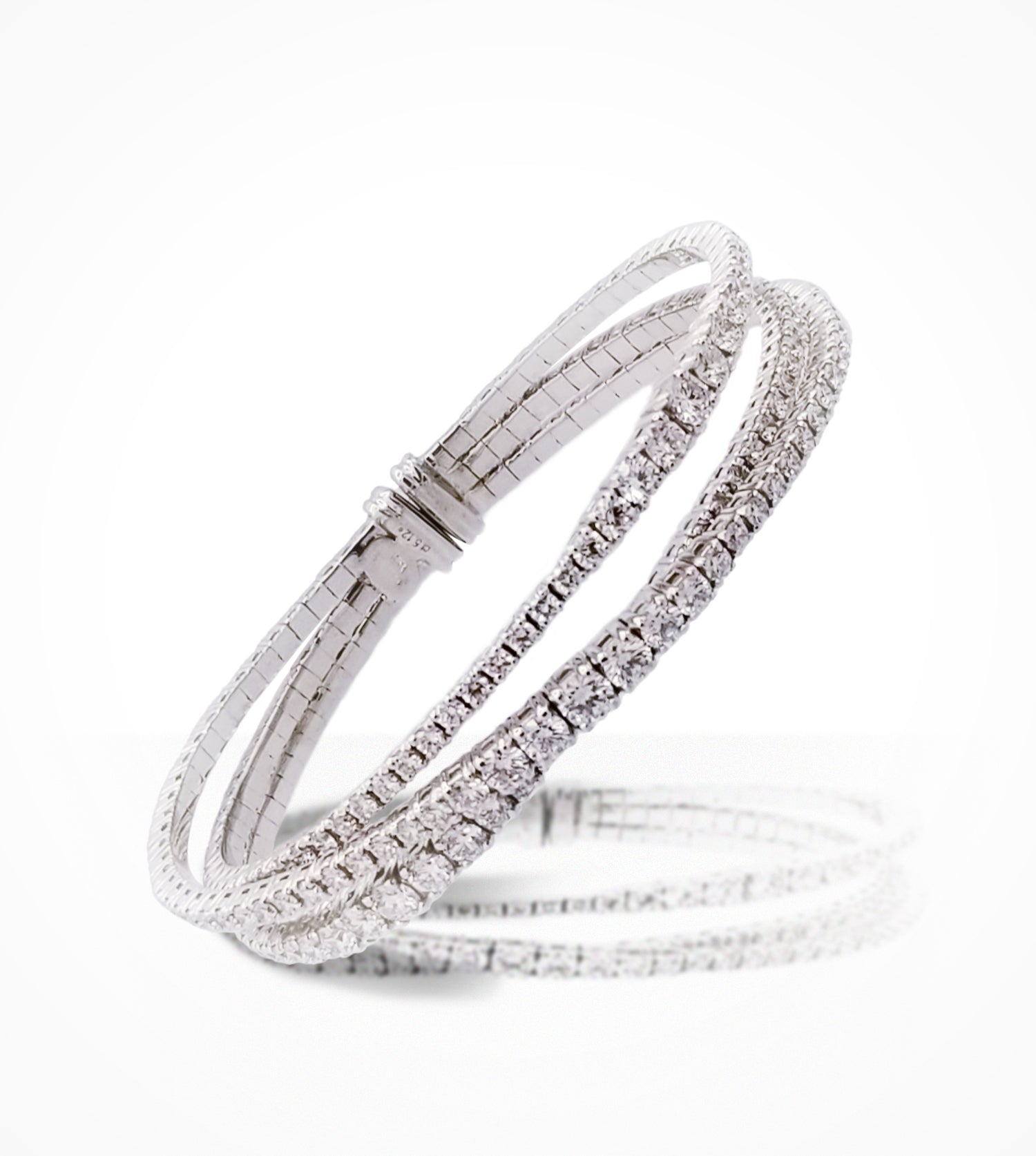 BR07285 18KW triple row diamond, flexible bangle. Diamonds=5.12cts g,si. Price upon Request