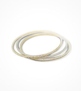 BR07287 18kt pave set two-tone bangles, 2 Yellow Gold, 1 White Gold. Diamonds=11.31cts. Price upon Request.