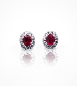 ER00359-18K white gold Ruby and diamond studs. 2 oval rubies=0.81cts, 20 diamonds=0.35cts. Total outside diameter 7.3x8.7mm