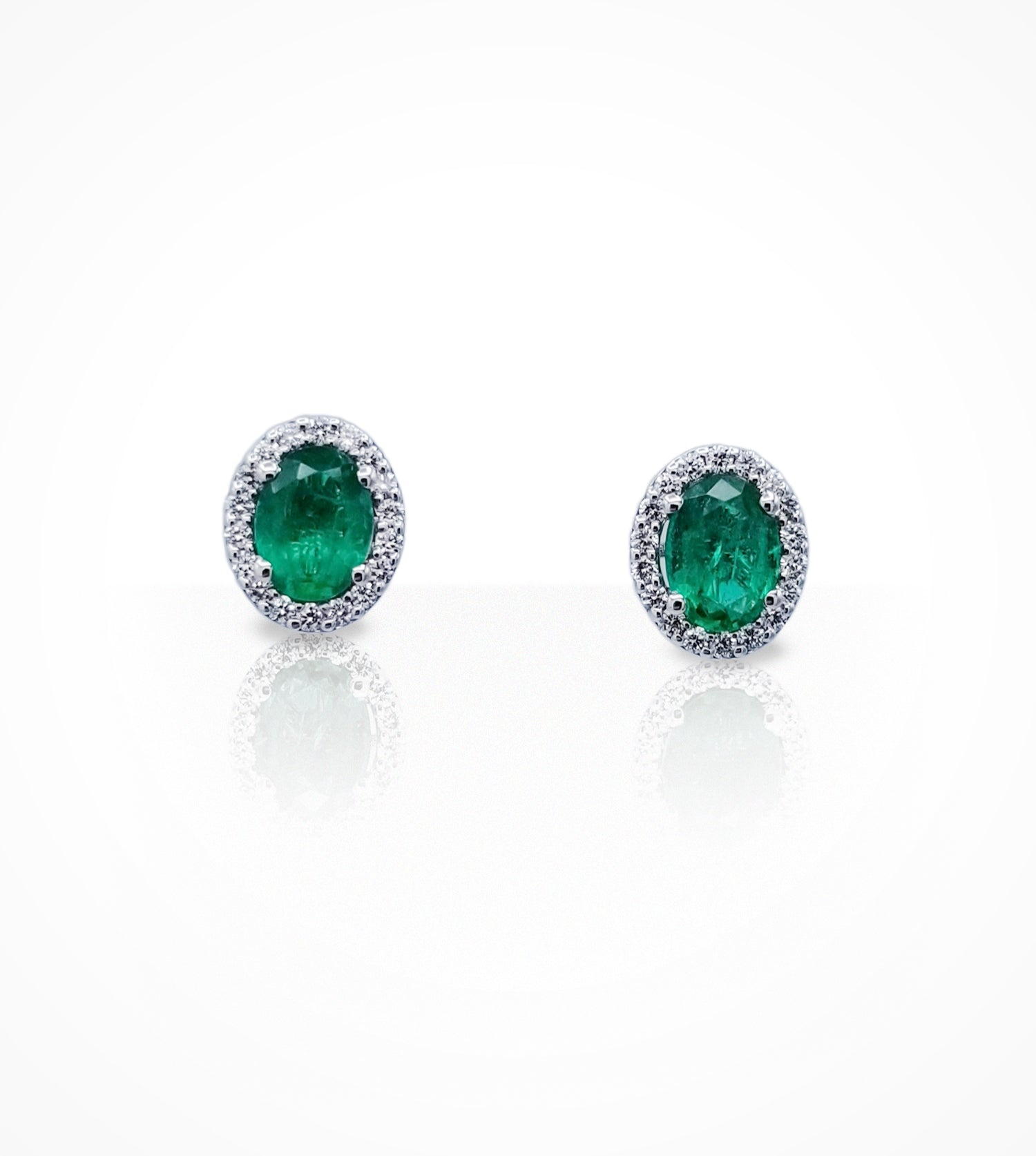 ER00540 18KW stud earrings, 2oval emeralds= 1.95cts, 8x6mm and 36 diamonds=0.42cts,-g-si